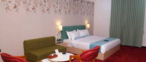 Premium bedding, desk, laptop workspace, iron/ironing board