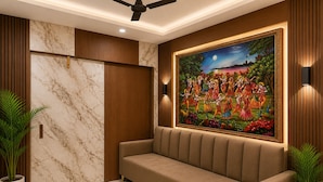 Un hall d’entrée moderne avec un mur en marbre, un canapé, un ventilateur de plafond et un grand tableau encadré.