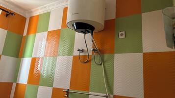 Bathtub, slippers, towels, soap