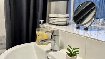 Hair dryer, towels, soap, toilet paper