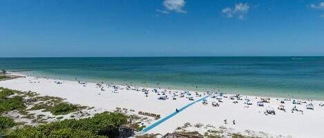 On the beach, sun-loungers, beach towels