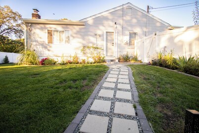 Central 2BR, Garden Suite, Top Amenities & Care!