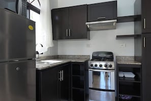 Fridge, stovetop, coffee/tea maker, cookware/dishes/utensils
