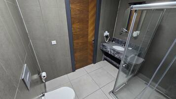 Twin Room, River View | Bathroom | Shower, hair dryer, slippers, towels