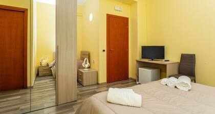 Room 'Seaside and City - Quadrupla' with Shared Terrace, Wi-Fi and Air Conditioning