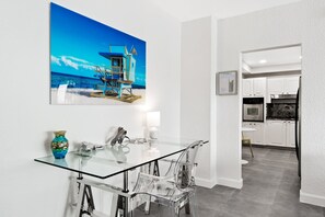 A modern kitchen with white cabinets and stainless steel appliances. - Newly Renovated~Walk to Beach~Close to Entertainment + Nightlife and Shopping (Hollywood)