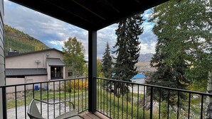 A covered outdoor area with a view of a mountain and trees. - Purgatory Townhomes 128, perfect for families in the heart of the Purgatory (Durango)