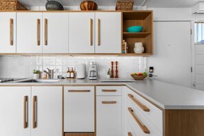 Fridge, coffee/tea maker, cookware/dishes/utensils