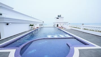 Outdoor pool, pool umbrellas, sun loungers