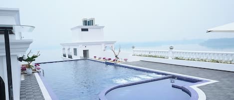 Outdoor pool, pool umbrellas, pool loungers