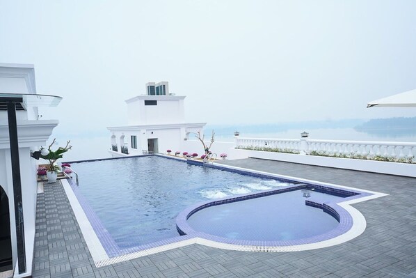 Outdoor pool, pool umbrellas, pool loungers