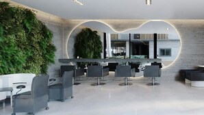 A modern bar area with a green wall, bar stools, and a counter. - SMART APARTMENT - EXTERNAL VIEW (Ipojuca)