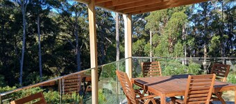 cosy cottage with wood heater, surrounded by bushland