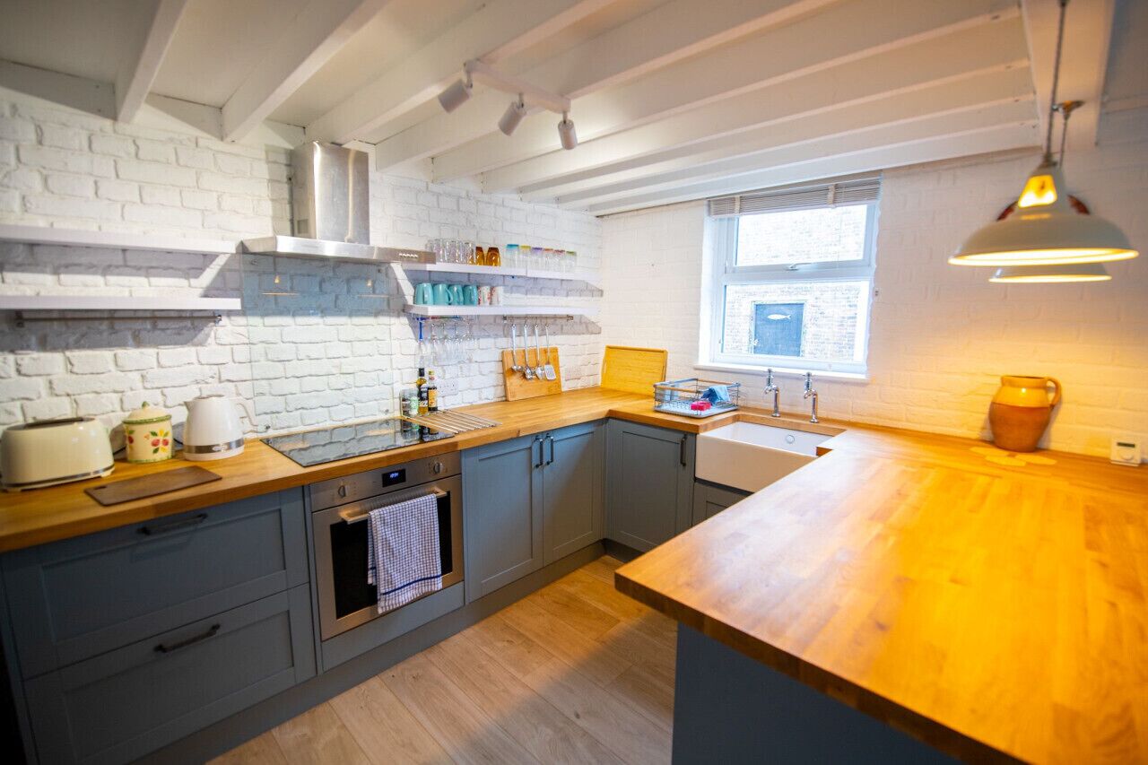 Fridge, stovetop, electric kettle, cookware/dishes/utensils