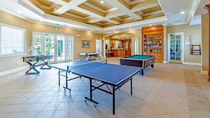 A spacious indoor area with a ping pong table, a pool table, and a billiards table. - 12-204 Legacy Dunes, Free WiFi, Heated Pool, Close to Disney (Kissimmee)