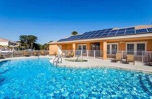Outdoor pool, a heated pool - The Coqui Cove near Disney Beautiful spacious Pool home (Clermont)