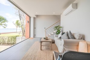 Villa, Partial Sea View | Living area | 32-inch flat-screen TV with cable channels