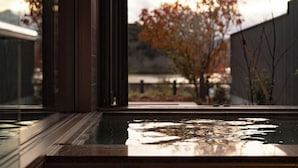 A view through a window with a pool reflecting the sky. - HOTEL and KOTEI SOKA (Kyotango)
