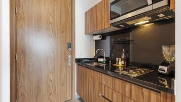 Fridge, microwave, stovetop, coffee/tea maker