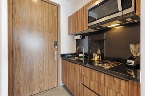 Fridge, microwave, stovetop, coffee/tea maker