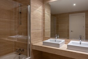 Shower, hair dryer, towels, toilet paper