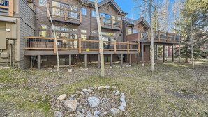 A multi-story wooden building with balconies and a deck area. - Village Point #212: Private Hot Tub and Easy Access to Town and Slopes (Breckenridge)