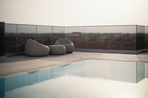 Outdoor pool, pool umbrellas, pool loungers