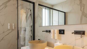 Executive Suite | Bathroom | Shower, hair dryer, slippers, towels