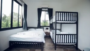 A room with bunk beds, a window with curtains, a bedside table, and a view of trees outside. - Issara Private Pool Villa Khaoyai A (Pak Chong)