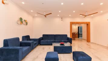 Family Penthouse | Living area | TV, fireplace, printers