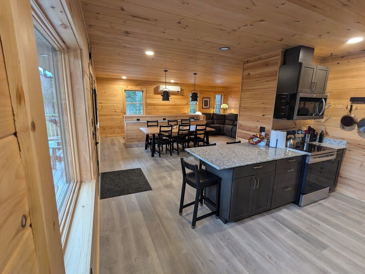 View from kitchen counter into dining room and upstairs living room