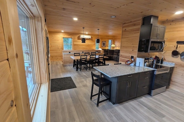 View from kitchen counter into dining room and upstairs living room
