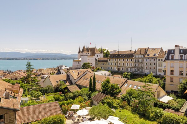 A historic town with a castle, terraced houses, and a waterfront.