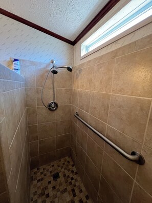 Shower, hair dryer, towels, toilet paper