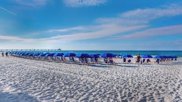 On the beach, sun-loungers