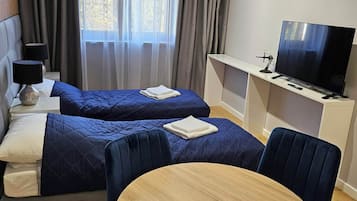 Deluxe Apartment, City View | 2 bedrooms, in-room safe, desk, laptop workspace
