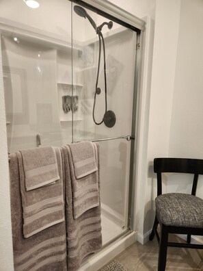 Shower, hair dryer, towels, soap