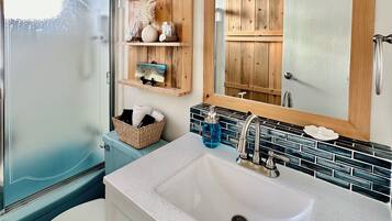 Shower, eco-friendly toiletries, hair dryer, towels