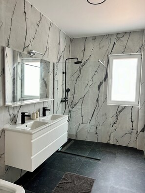 Shower, towels, soap, toilet paper