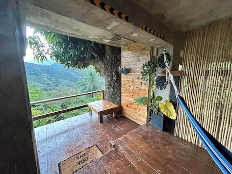 Terrace/patio. Cozy cabin with hot water jacuzzi and AC in the mountains of Guayama.
