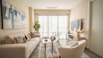 One Bedroom Standard | Living area | 40-inch Smart TV with satellite channels