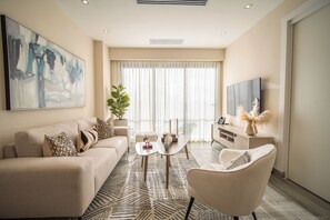 One Bedroom Standard | Living area | 40-inch Smart TV with satellite channels