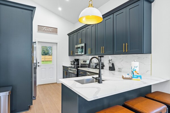 Fridge, microwave, oven, stovetop - Modern, Cozy and Spacious Home in Foley Alabama. (Foley)