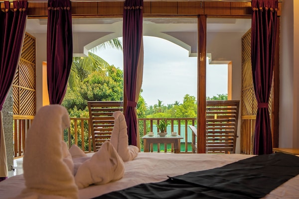 Deluxe Double Room, Balcony, Garden View | Laptop workspace, free WiFi, bed sheets