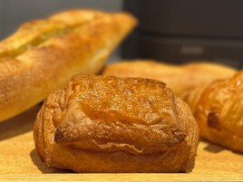 A close-up of pastries on a wooden surface.