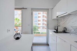 Fridge, microwave, stovetop, coffee/tea maker