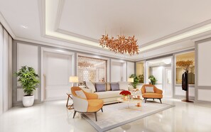 Habitación doble de lujo (Luxury Suite) | Área de sala de estar | Televisión LCD de 65 pulgadas con canales por cable 