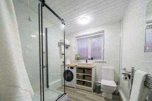 Shower, hair dryer, towels, soap