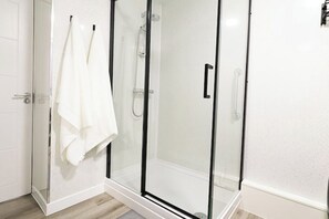 Shower, hair dryer, towels, soap