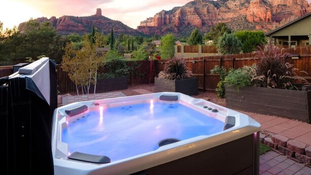 A hot tub in a backyard with a mountain backdrop. - Thunder Mtn, Coffee Pot Views, Hot Tub Getaway (Sedona)
